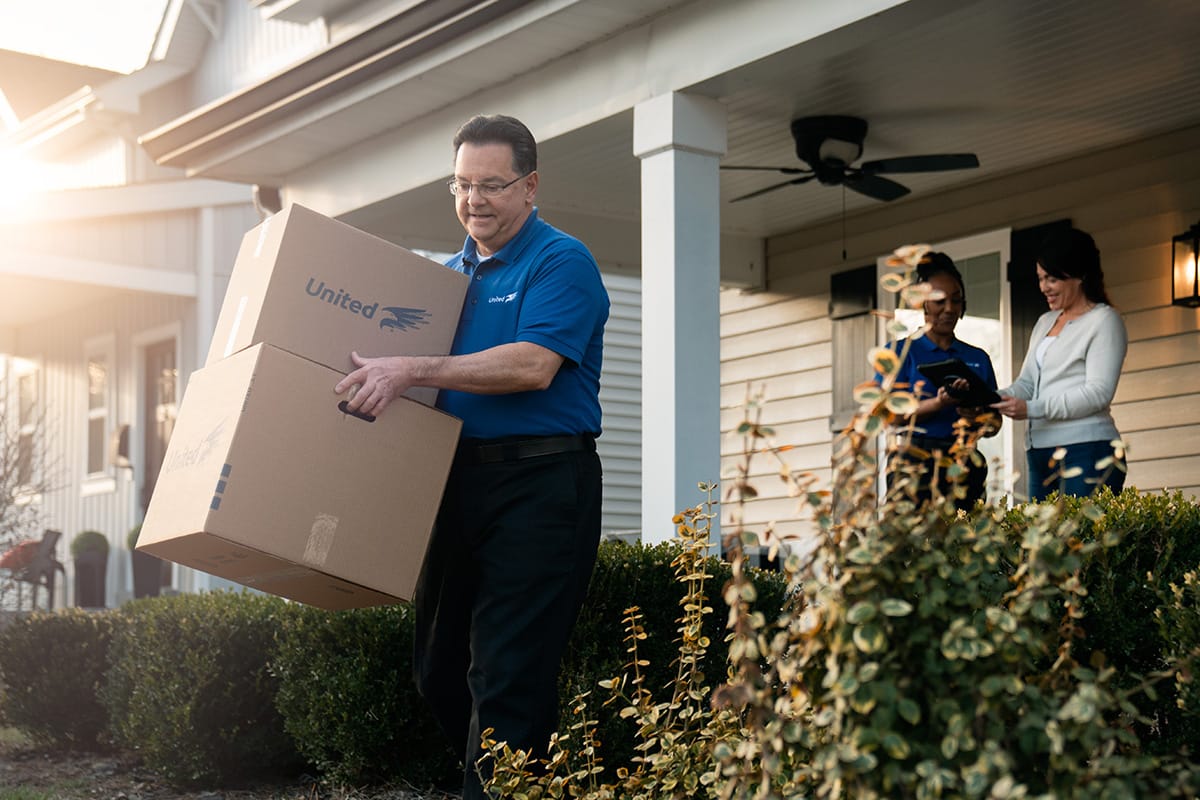 Team Member Carrying - The Benefits Of Hiring Local Movers In Madison, WI