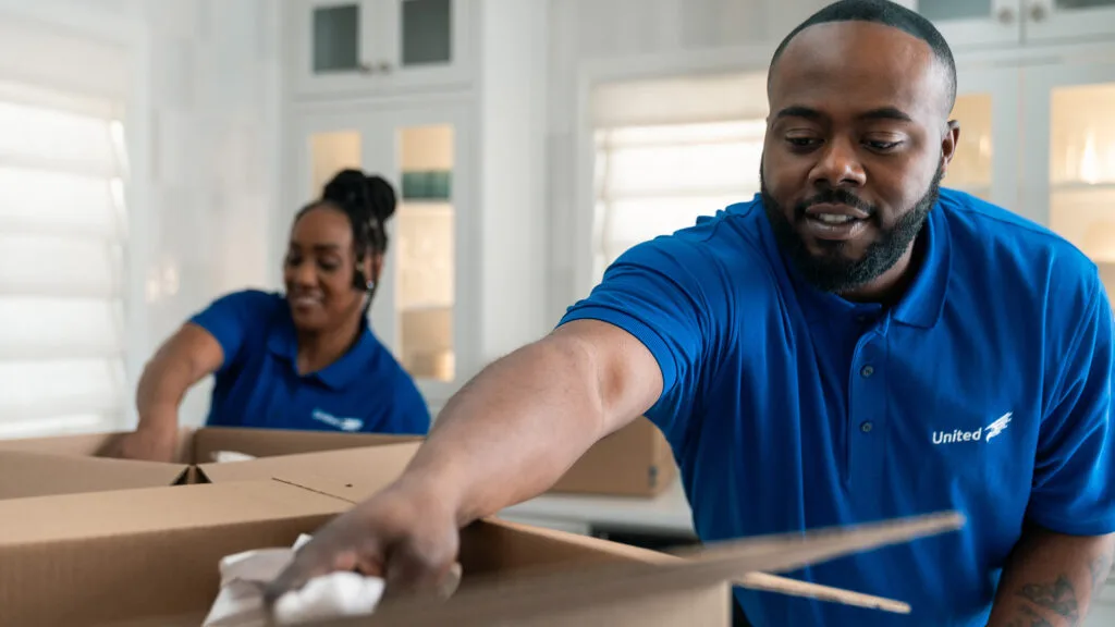 Close of Christofferson employees packing a residential home