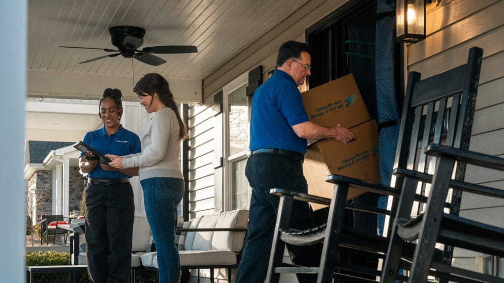Residential moving services with Christofferson employees unloading boxes
