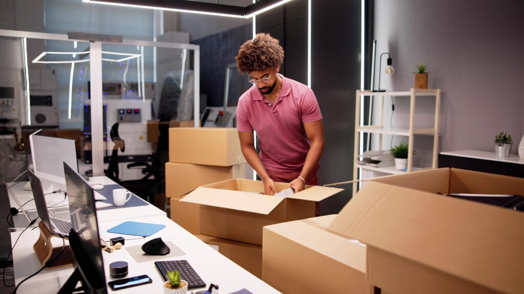 Man packing up a modern office