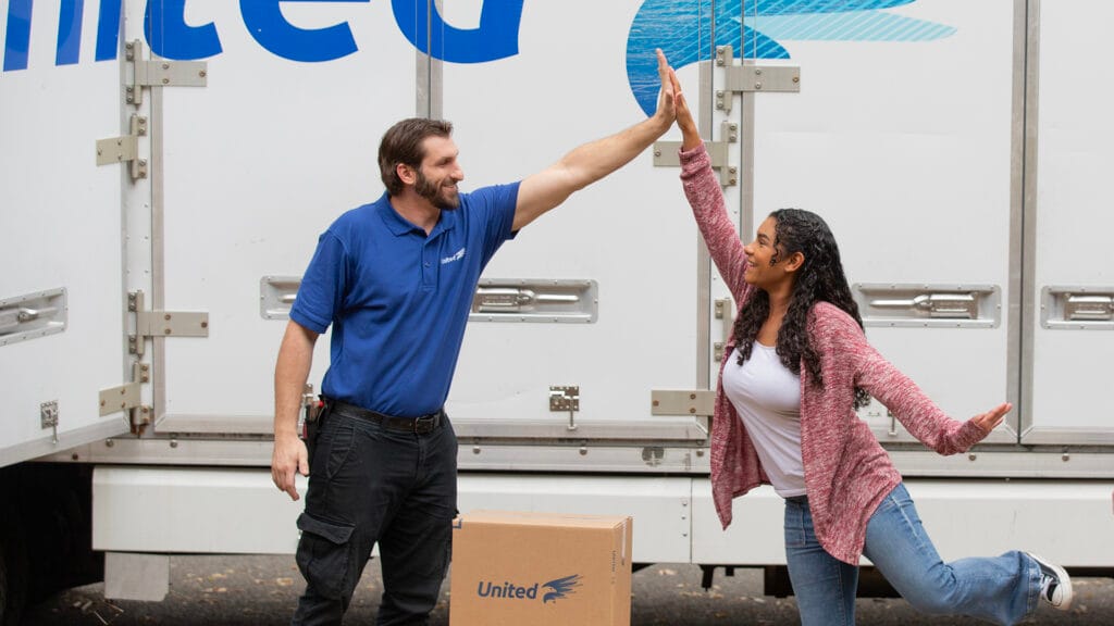 United Van Lines Employee high-fiving home-owner