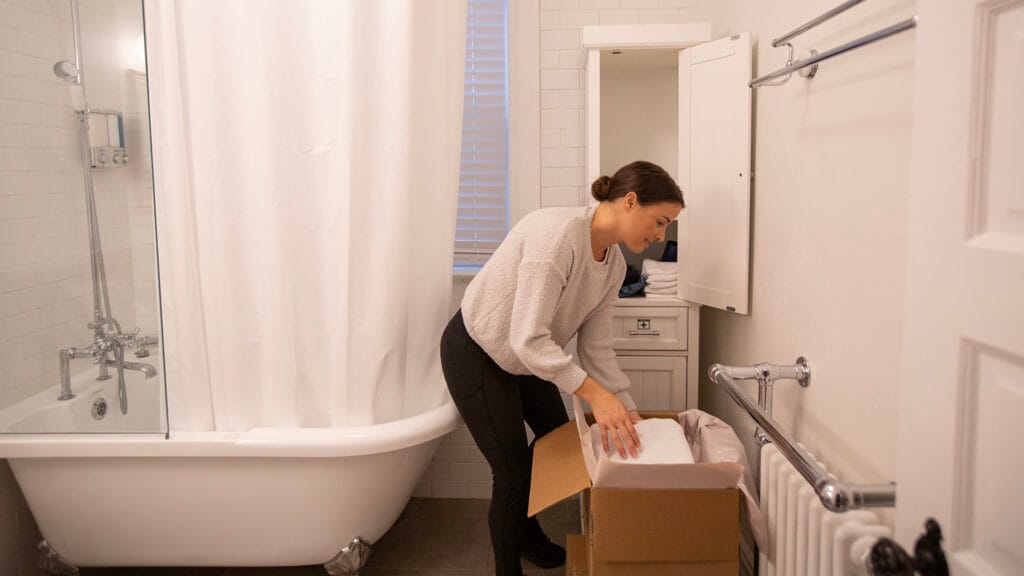 Home owner packing her bathroom
