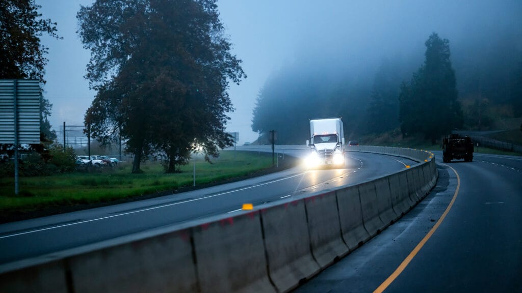 Christofferson moving truck in rain dust fog
