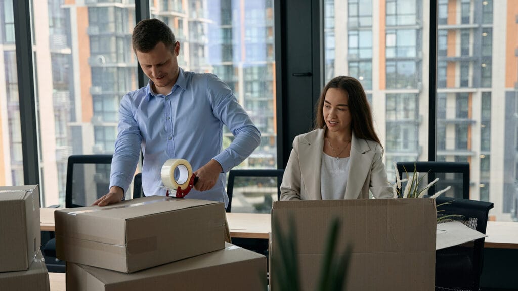 Commercial employees packing and moving