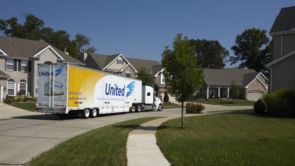 Christofferson United Van Line Semi-Truck driving through a residential area