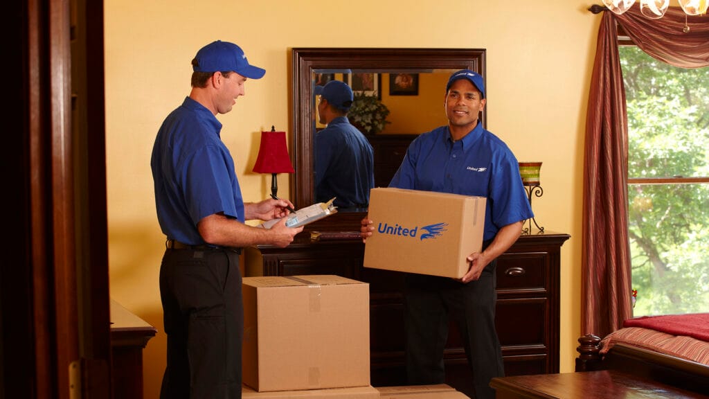 Christofferson workers packing up a living room