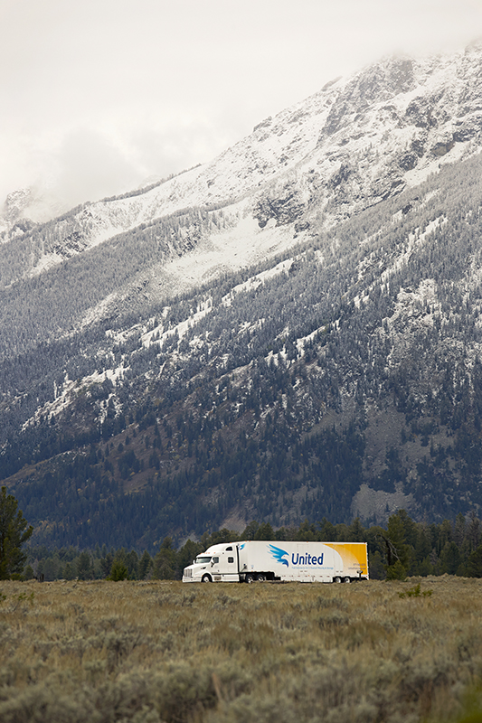 Christofferson semi-truck traveling long-distance with mountains in the background