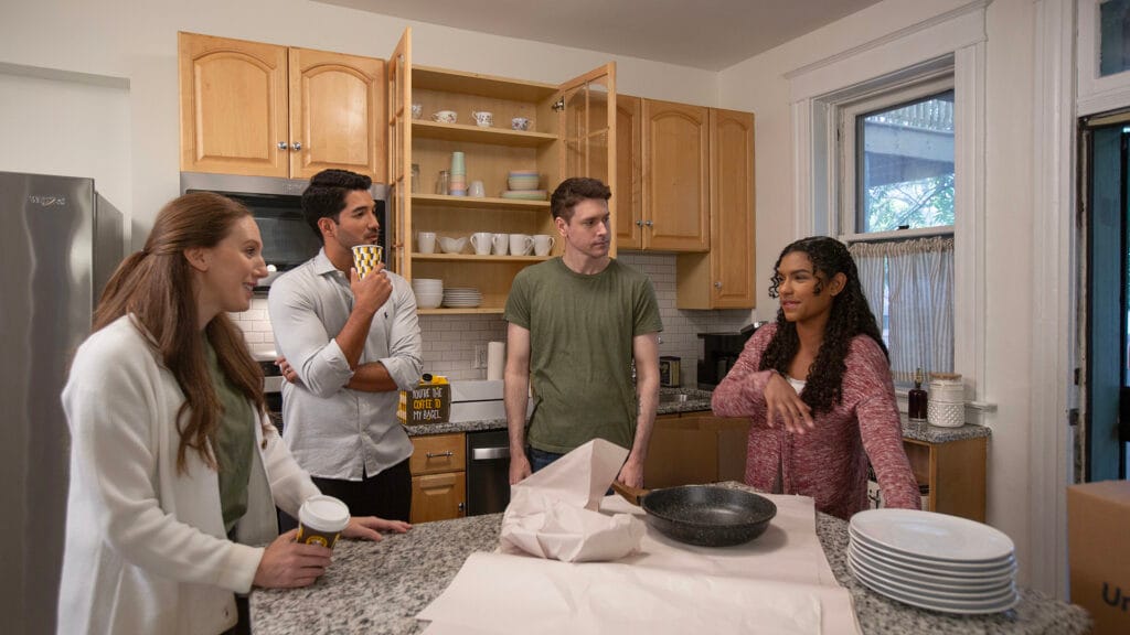 Group of friend packing kitchen