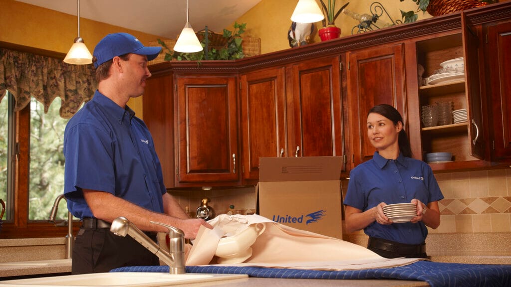 Christofferson worker packing a kitchen