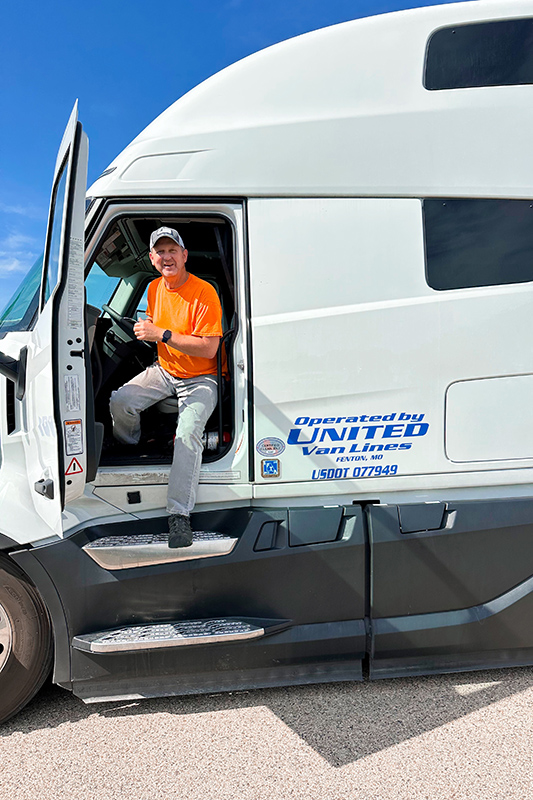 Christofferson employee exiting semi-truck cabin